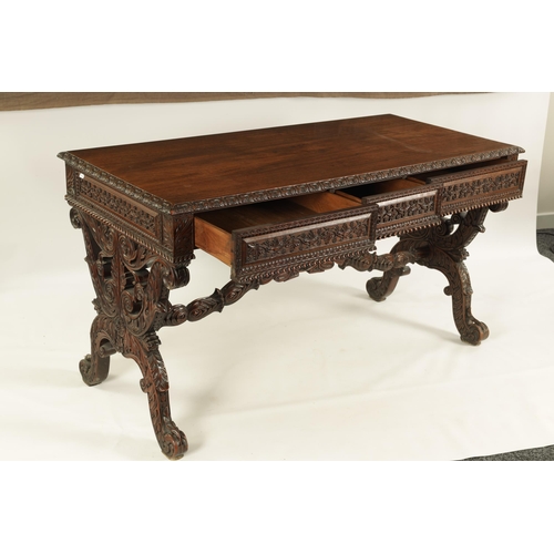 217 - A REGENCY ANGLO INDIAN CARVED HARDWOOD LIBRARY TABLE of good colour and patina, the polished top wit... 