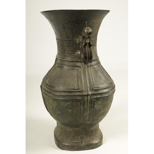 218 - A LARGE CHINESE MING DYNASTY SQUARE SECTION TWO-HANDLED BRONZE BALUSTER VASE with dragon decorated f... 