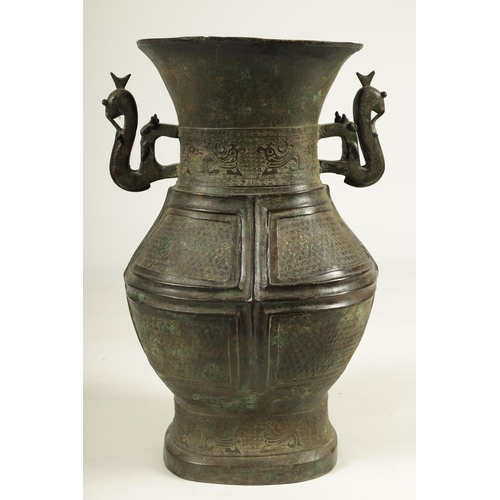 218 - A LARGE CHINESE MING DYNASTY SQUARE SECTION TWO-HANDLED BRONZE BALUSTER VASE with dragon decorated f... 