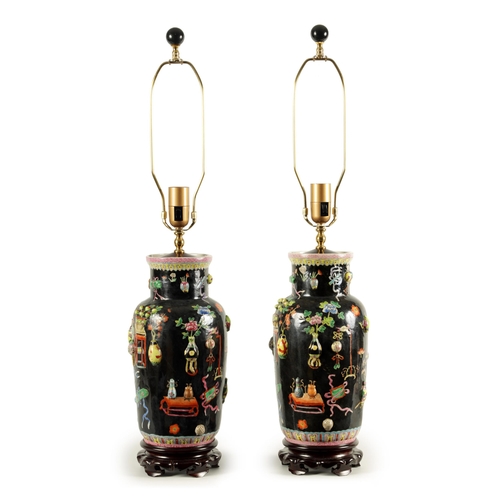 223 - A PAIR OF CHINESE REPUBLIC FAMILLE NOIRE PORCELAIN VASES CONVERTED INTO TABLE LAMPS each decorated w... 