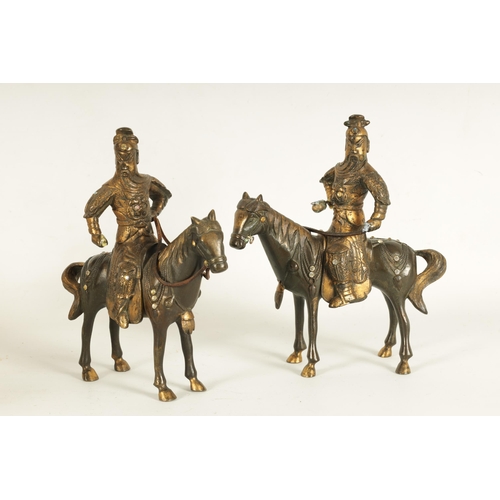 230 - A PAIR OF GILT BRONZE 18TH CENTURY STYLE CHINESE EQUESTRIAN FIGURES of mounted warriors with jewelle... 