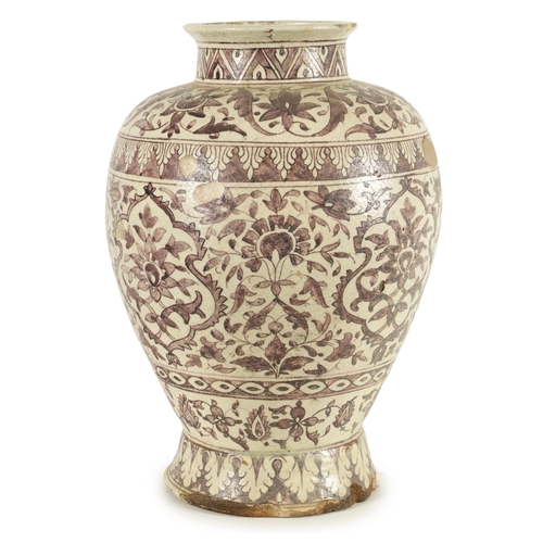 232 - AN EARLY PERSIAN EARTHENWARE LARGE TAPERING SHOULDERED FOOTED VASE with all round floral and leaf ba... 