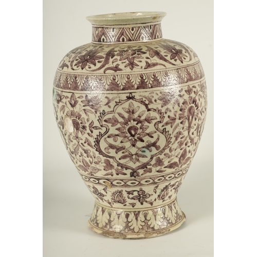 232 - AN EARLY PERSIAN EARTHENWARE LARGE TAPERING SHOULDERED FOOTED VASE with all round floral and leaf ba... 