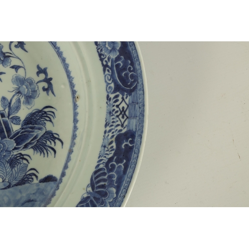 237 - AN 18TH/19TH CENTURY CHINESE BLUE AND WHITE LARGE SHALLOW DISH with a moulded centre edge, decorated... 