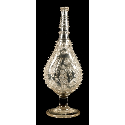 25 - AN 18TH CENTURY LARGE TAPERING CLEAR GLASS FLASK of footed flattened ovoid form with a ringed neck a... 