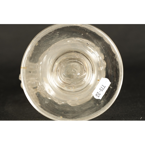 25 - AN 18TH CENTURY LARGE TAPERING CLEAR GLASS FLASK of footed flattened ovoid form with a ringed neck a... 