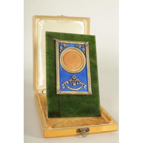 252 - FABERGE. AN EARLY 20TH CENTURY CASED RUSSIAN SILVER-GILT ENAMEL AND NEPHRITE PORTRAIT FRAME the imag... 