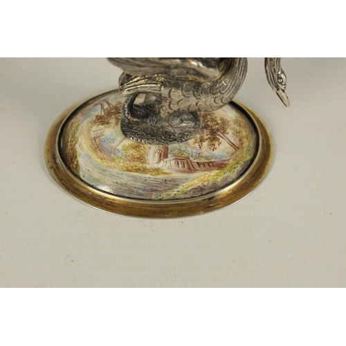 256 - A 19TH CENTURY VIENNESE SILVER AND ENAMEL TABLE SALT of shell form supported by a silver swan mounte... 