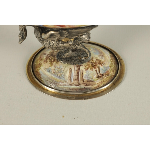 256 - A 19TH CENTURY VIENNESE SILVER AND ENAMEL TABLE SALT of shell form supported by a silver swan mounte... 