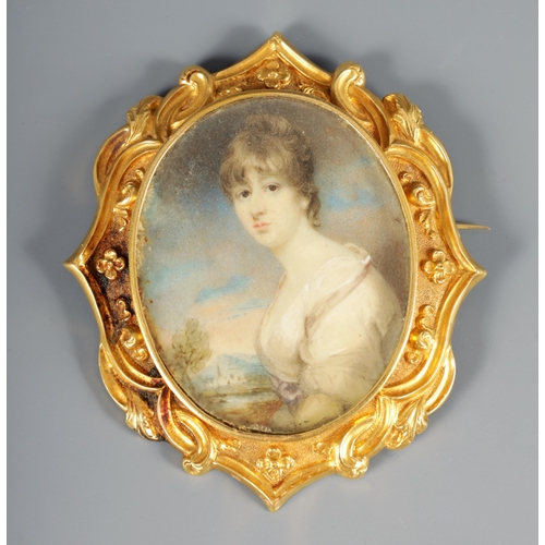 264 - A REGENCY 18CT GOLD FRAMED MINIATURE PORTRAIT ON IVORY depicting a young woman in classical dress in... 