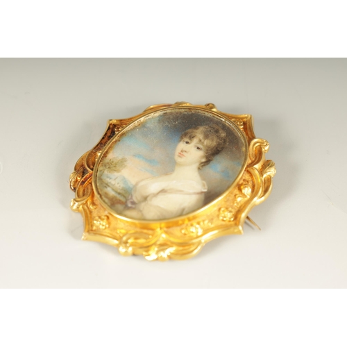 264 - A REGENCY 18CT GOLD FRAMED MINIATURE PORTRAIT ON IVORY depicting a young woman in classical dress in... 