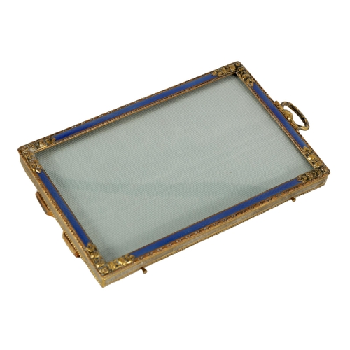 279 - A 19TH CENTURY FRENCH GILT BRASS AND BLUE GUILLOCHE ENAMEL PICTURE FRAME OF SMALL SIZE with flower h... 