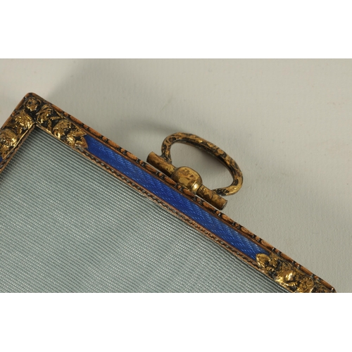 279 - A 19TH CENTURY FRENCH GILT BRASS AND BLUE GUILLOCHE ENAMEL PICTURE FRAME OF SMALL SIZE with flower h... 