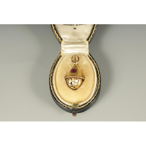 280 - A LATE 19TH CENTURY FABERGE 14CT GOLD ENAMEL AND RUBY PENDANT EGG, WORKMASTER HENRIK WIGSTROM the eg... 