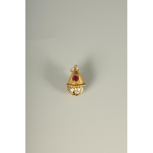 280 - A LATE 19TH CENTURY FABERGE 14CT GOLD ENAMEL AND RUBY PENDANT EGG, WORKMASTER HENRIK WIGSTROM the eg... 