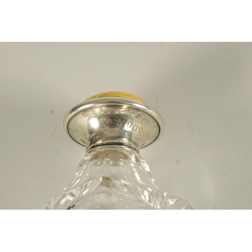 282 - AN ART DECO SILVER AND GUILLOCHE ENAMEL CUT GLASS SCENT BOTTLE the flared silver lid with a yellow s... 