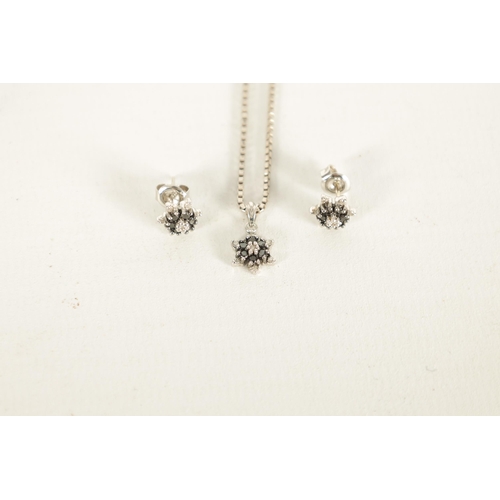 283 - A SET OF VINTAGE 9CT WHITE GOLD BLACK DIAMOND NECKLACE AND EARRINGS with six-point stars on a square... 