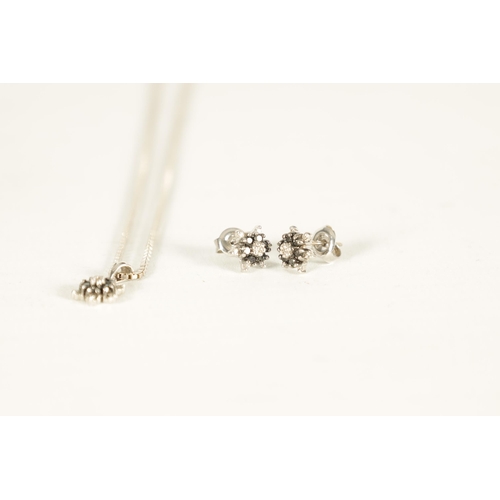 283 - A SET OF VINTAGE 9CT WHITE GOLD BLACK DIAMOND NECKLACE AND EARRINGS with six-point stars on a square... 