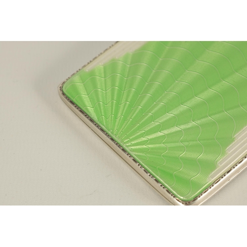 285 - AN ART DECO SILVER AND GUILLOCHE ENAMEL CIGARETTE CASE with green sunburst ray and overall wave patt... 