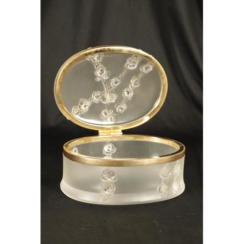 29 - LALIQUE, FRANCE. A 20TH CENTURY COPPELIA OVAL FROSTED GLASS DRESSING TABLE BOX decorated with Roses,... 