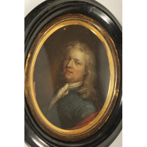 297 - AN 18TH CENTURY MINIATURE BUST PORTRAIT ON COPPER OF A GENTLEMAN in glazed gilt and ebonised frame (... 