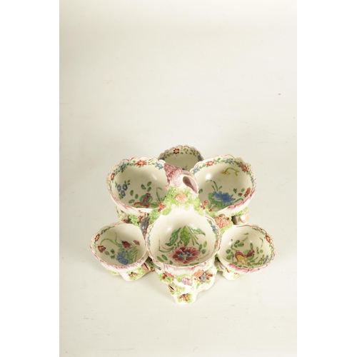 33 - AN UNUSUAL 18TH CENTURY BOW PORCELAIN SWEET MEAT STAND of two-tier form with centre shell work handl... 