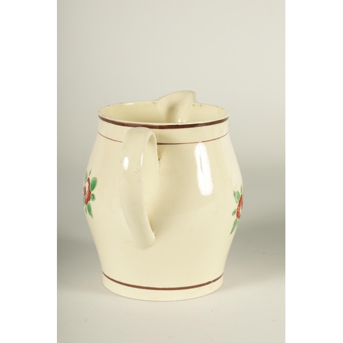 34 - AN EARLY 19TH CENTURY CREAMWARE PRESENTATION JUG of bellied form with flower head and leaf spray dec... 