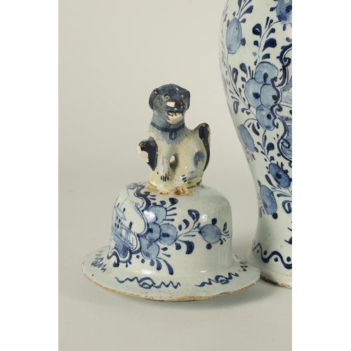 36 - A PAIR OF 18TH CENTURY BLUE AND WHITE DELFT VASES AND COVER the inverted baluster bodies decorated w... 