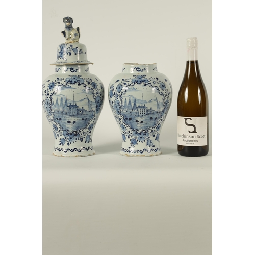 36 - A PAIR OF 18TH CENTURY BLUE AND WHITE DELFT VASES AND COVER the inverted baluster bodies decorated w... 