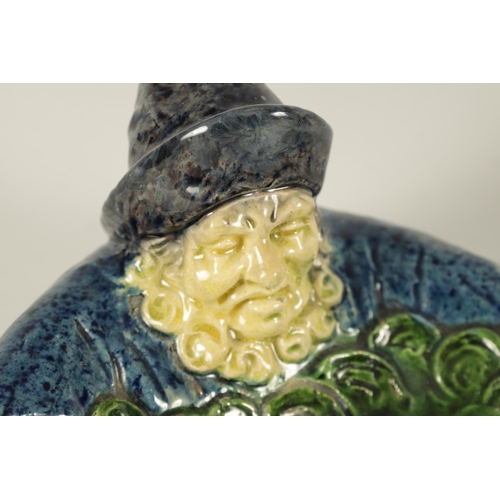 42 - A 19TH CENTURY FRENCH MAJOLICA POLYCHROME PIN TRAY MODELLED AS A FISHERMAN depicted clutching a larg... 