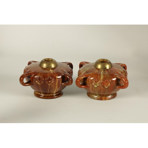 43 - A PAIR OF LATE 19TH CENTURY LINTHORPE LAMP BASES IN THE MANNER OF CHRISTOPHER DRESSER of squat foote... 