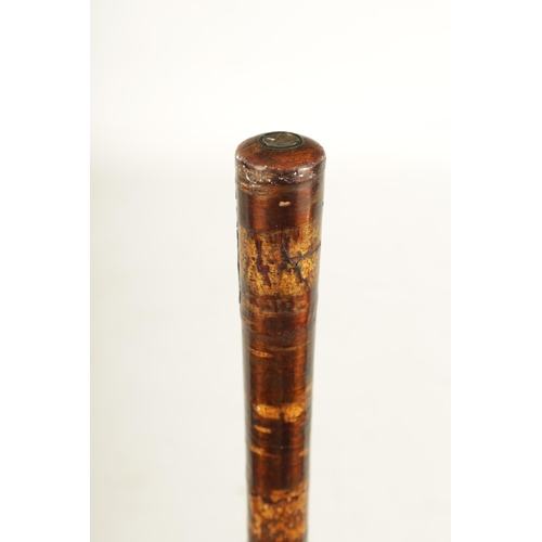 430 - A RARE MEIJI PERIOD JAPANESE SAMURAI SWORD STICK with lacquered stick, the handle enclosing a glazed... 