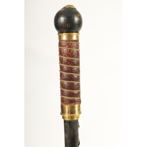 432 - AN EARLY 20TH CENTURY EBONISED AND LEATHER MOUNTED SWORD STICK with brass crown and Britannia mounts... 