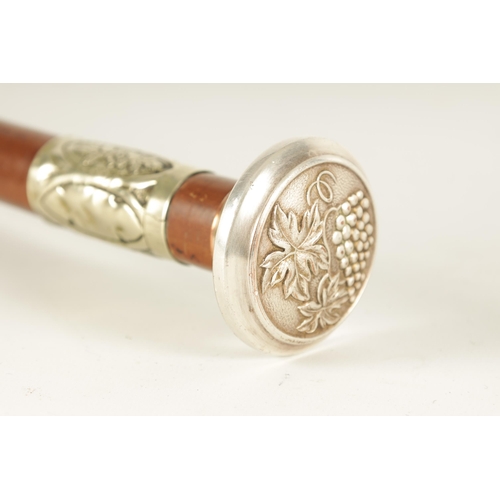 435 - AN ART NOUVEAU MALACCA AND SILVER METAL SWORD STICK the handle embossed with grapes on a vine and ma... 