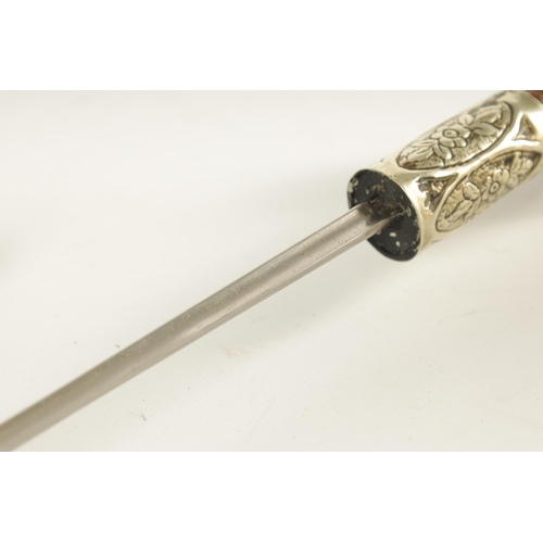 435 - AN ART NOUVEAU MALACCA AND SILVER METAL SWORD STICK the handle embossed with grapes on a vine and ma... 