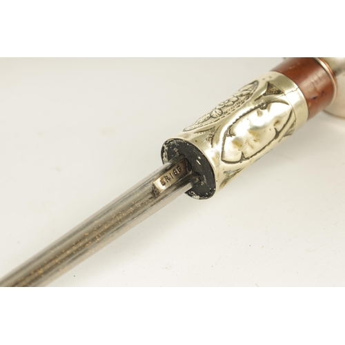 435 - AN ART NOUVEAU MALACCA AND SILVER METAL SWORD STICK the handle embossed with grapes on a vine and ma... 