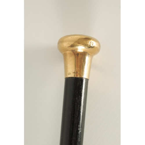 436 - A LATE 19TH CENTURY 9CT GOLD HANDLED WALKING STICK with ebonised tapering shaft - hallmarked .375 (9... 