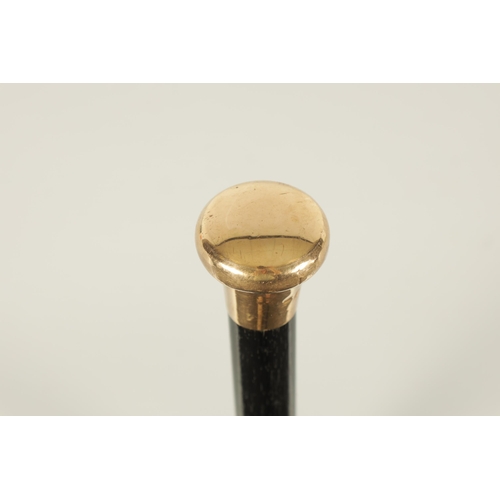 436 - A LATE 19TH CENTURY 9CT GOLD HANDLED WALKING STICK with ebonised tapering shaft - hallmarked .375 (9... 