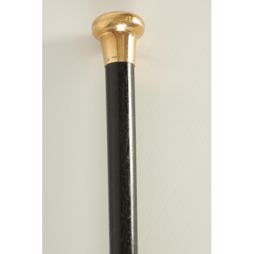 436 - A LATE 19TH CENTURY 9CT GOLD HANDLED WALKING STICK with ebonised tapering shaft - hallmarked .375 (9... 