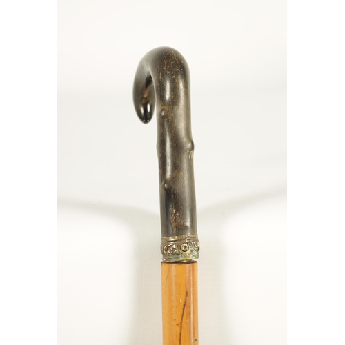 437 - A LATE 19TH CENTURY RHINOCEROS HORN HANDLED SWORD STICK the horn handle carved to simulate hawthorn ... 