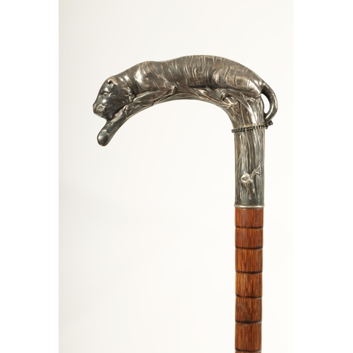 441 - A LATE 19TH CENTURY FRENCH ART NOUVEAU SILVER MOUNTED PALM WOOD WALKING STICK the handle finely mode... 