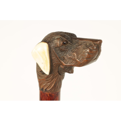 444 - A SELECTION OF THREE CARVED DOG'S HEAD WALKING STICKS comprising of a Black forest dog's head with i... 