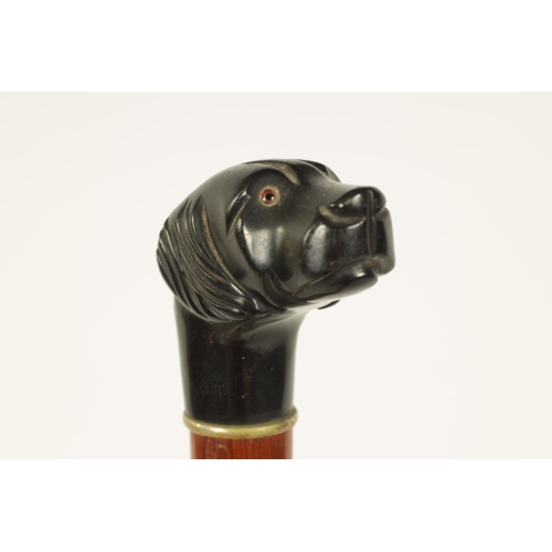 444 - A SELECTION OF THREE CARVED DOG'S HEAD WALKING STICKS comprising of a Black forest dog's head with i... 