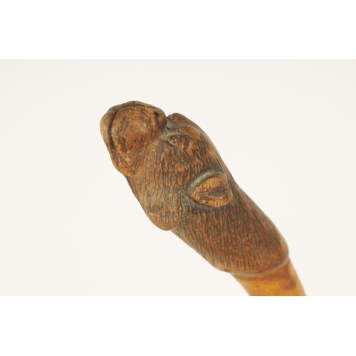 444 - A SELECTION OF THREE CARVED DOG'S HEAD WALKING STICKS comprising of a Black forest dog's head with i... 