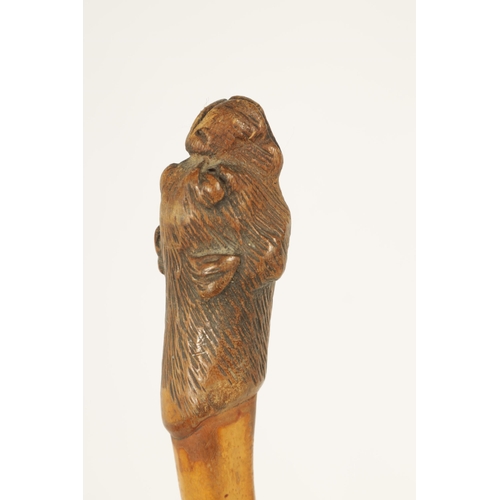 444 - A SELECTION OF THREE CARVED DOG'S HEAD WALKING STICKS comprising of a Black forest dog's head with i... 