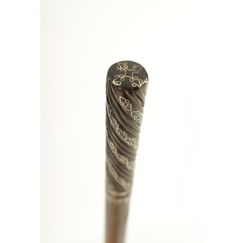 445 - A LATE 19TH CENTURY FRENCH ROSEWOOD AND SILVER PIQUEWORK WALKING CANE with swirl carved handle inlai... 