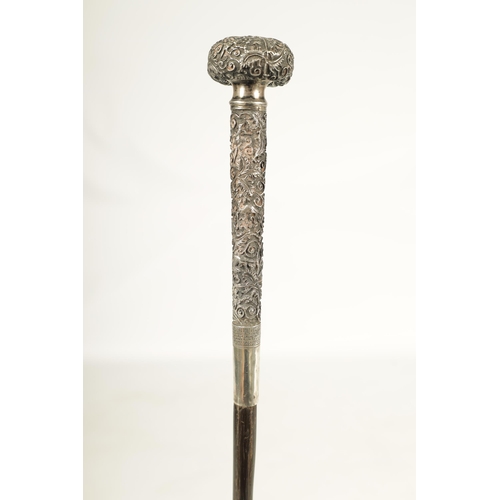 446 - A LATE 19TH CENTURY CHINESE SILVER MOUNTED RHINOCEROS HORN WALKING CANE profusely embossed with bird... 