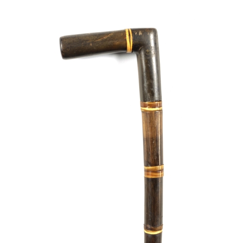 447 - A 19TH CENTURY SEGMENTED RHINOCEROS HORN WALKING STICK made up of eighteen pieces of tapered horn (7... 