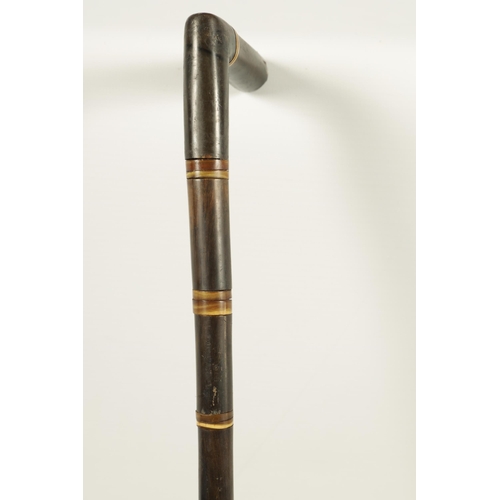 447 - A 19TH CENTURY SEGMENTED RHINOCEROS HORN WALKING STICK made up of eighteen pieces of tapered horn (7... 