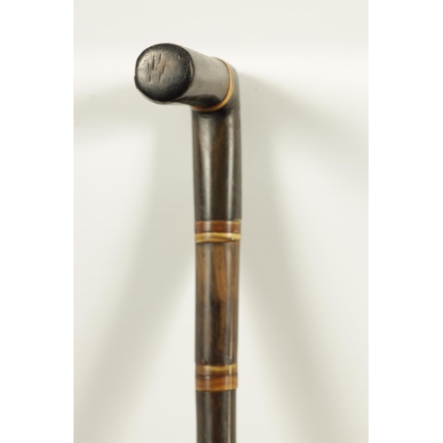 447 - A 19TH CENTURY SEGMENTED RHINOCEROS HORN WALKING STICK made up of eighteen pieces of tapered horn (7... 